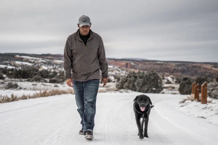 Man and his Service Dog side by side